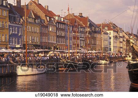 Copenhagen, Denmark, canal, Scandinavia, Sjaelland, Europe, Crowds of people along Nyhavn (New Harbor) in the scenic city of Copenhagen View Large Photo Image Stock Photo - Copenhagen, Denmark, canal, Scandinavia, Sjaelland, Europe, Crowds of people along Nyhavn (New Harbor) in the scenic city of Copenhagen. Fotosearch