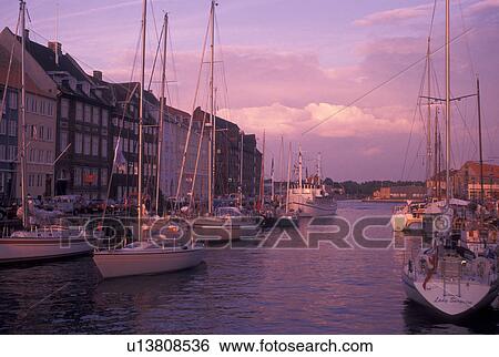 Copenhagen, Denmark, canal, Scandinavia, Sjaelland, Europe, Boats docked along Nyhavn (New Harbor) in the scenic city of Copenhagen View Large Photo Image Stock Photograph - Copenhagen, Denmark, canal, Scandinavia, Sjaelland, Europe, Boats docked along Nyhavn (New Harbor) in the scenic city of Copenhagen. Fotosearch