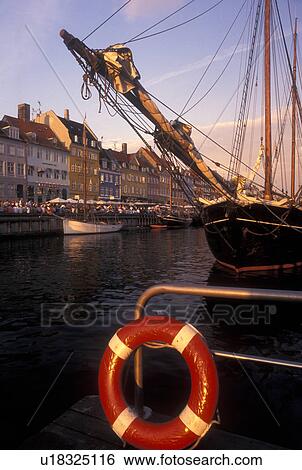 Copenhagen, Denmark, canal, Scandinavia, Sjaelland, Europe, Boats docked along Nyhavn (New Harbor) in the scenic city of Copenhagen View Large Photo Image Stock Photograph - Copenhagen, Denmark, canal, Scandinavia, Sjaelland, Europe, Boats docked along Nyhavn (New Harbor) in the scenic city of Copenhagen. Fotosearch