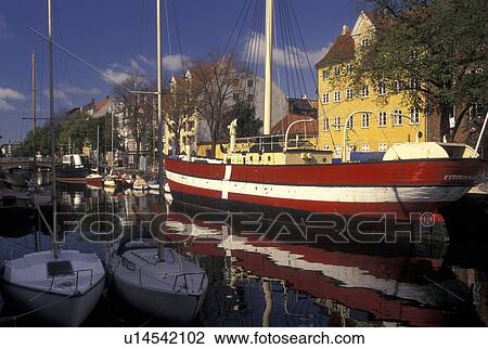 Copenhagen, Denmark, Scandinavia, Sjaelland, Europe, Large red and white sailboat (flagship) docked along a canal in the scenic city of Copenhagen. View Large Photo Image Stock Image - Copenhagen, Denmark, Scandinavia, Sjaelland, Europe, Large red and white sailboat (flagship) docked along a canal in the scenic city of Copenhagen. . Fotosearch