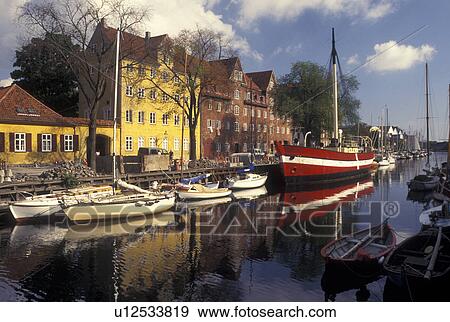 Copenhagen, Denmark, Scandinavia, Sjaelland, Europe, Boats and buildings along a canal in the scenic city of Copenhagen. View Large Photo Image Stock Photo - Copenhagen, Denmark, Scandinavia, Sjaelland, Europe, Boats and buildings along a canal in the scenic city of Copenhagen. . Fotosearch