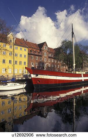 Stock Photograph -  Copenhagen, Denmark, Scandinavia, Sjaelland, Europe, Large red and white sailboat (flagship) docked along a canal in the scenic city of Copenhagen. . Fotosearch