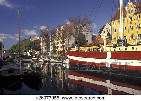 Stock Photograph -  Copenhagen, Denmark, Scandinavia, Sjaelland, Europe, Large red and white sailboat (flagship) docked along a canal in the scenic city of Copenhagen. . Fotosearch