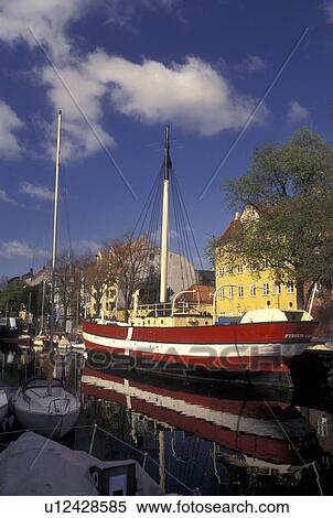 Copenhagen, Denmark, Scandinavia, Sjaelland, Europe, Large red and white sailboat (flagship) docked along a canal in the scenic city of Copenhagen. View Large Photo Image Stock Photography - Copenhagen, Denmark, Scandinavia, Sjaelland, Europe, Large red and white sailboat (flagship) docked along a canal in the scenic city of Copenhagen. . Fotosearch