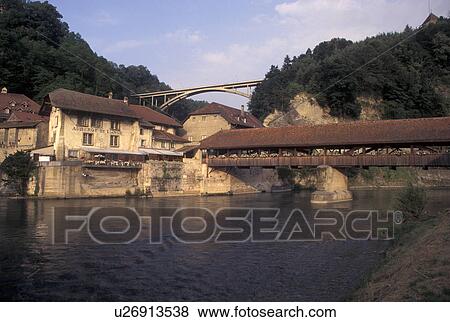 Stock Photo -  covered bridge, Fribourg, Switzerland, Pont de Berne, covered bridge, crosses the Saane River in the city of Fribourg. . Fotosearch