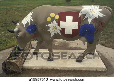 Stock Image -  cow, New Glarus, WI, Wisconsin, Little Switzerland, Painted swiss cow in the town of New Glarus.. Fotosearch