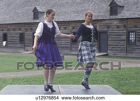 dancing, Thunder Bay, Canada, Ontario, Two girls dressed in authentic costumes celebrate Scottish Days by doing the Highland Dance at the Main Square at Old Fort William, Fur Trading Post, in Thunder Bay. View Large Photo Image Picture - dancing, Thunder Bay, Canada, Ontario, Two girls dressed in authentic costumes celebrate Scottish Days by doing the Highland Dance at the Main Square at Old Fort William, Fur Trading Post, in Thunder Bay.. Fotosearch