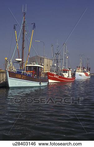 Denmark, Romo, Jylland, Scandinavia, Europe, Fishing boats docked in Havneby Harbor on the North Sea on Romo Island. View Large Photo Image Stock Photograph - Denmark, Romo, Jylland, Scandinavia, Europe, Fishing boats docked in Havneby Harbor on the North Sea on Romo Island.. Fotosearch
