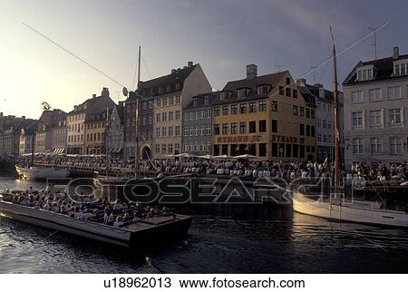 Denmark, Scandinavia, Copenhagen, Sjaelland, canal, Europe, Tour boat cruises Nyhavn (New Harbor) along the scenic city of Copenhagen View Large Photo Image Stock Image - Denmark, Scandinavia, Copenhagen, Sjaelland, canal, Europe, Tour boat cruises Nyhavn (New Harbor) along the scenic city of Copenhagen. Fotosearch