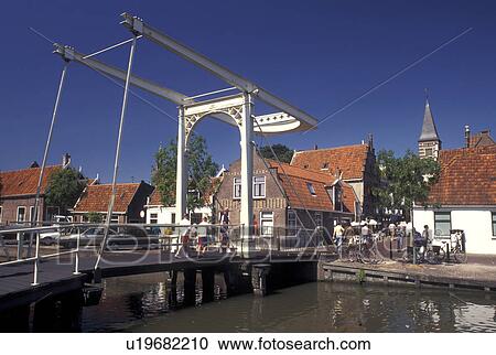 drawbridge, Holland, Edam, Netherlands, Noord-Holland, Europe, Pedestrian drawbridge crosses a canal in the city of Edam. View Large Photo Image Stock Image - drawbridge, Holland, Edam, Netherlands, Noord-Holland, Europe, Pedestrian drawbridge crosses a canal in the city of Edam.. Fotosearch