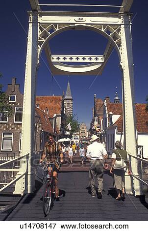 drawbridge, Holland, Edam, Netherlands, Noord-Holland, Europe, Pedestrian drawbridge crosses a canal in the city of Edam. View Large Photo Image Stock Photo - drawbridge, Holland, Edam, Netherlands, Noord-Holland, Europe, Pedestrian drawbridge crosses a canal in the city of Edam.. Fotosearch
