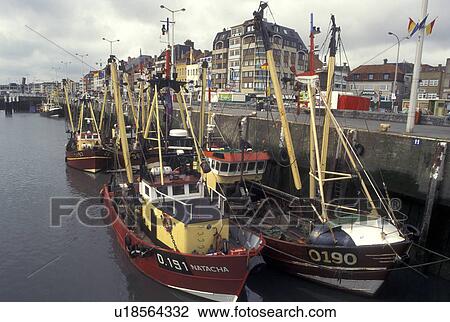 Fishing boats, Belgium, Oostende, West-Vlaanderen, Europe, North Sea, Fishing boats docked along the harbor in the town of Oostende. View Large Photo Image Stock Image - Fishing boats, Belgium, Oostende, West-Vlaanderen, Europe, North Sea, Fishing boats docked along the harbor in the town of Oostende.. Fotosearch