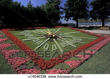 floral clock, Switzerland, Lausanne, Ouchy, Vaud, Lac Leman, Floral clock in a lakefront park along Lake Geneva in Ouchy. View Large Photo Image Stock Photo - floral clock, Switzerland, Lausanne, Ouchy, Vaud, Lac Leman, Floral clock in a lakefront park along Lake Geneva in Ouchy.. Fotosearch