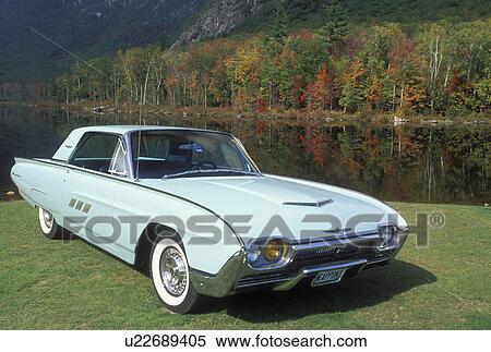 Stock Photography -  Ford Thunderbird, NH, New Hampshire, White Mountains National Forest, Basin Pond, 1963 Ford Thunderbird parked at a picnic area at Basin Pond.. Fotosearch