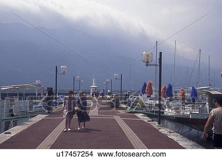 France, Aix-Les-Bains, Savoie, Rhone-Alpes, Europe, People walking on the pier on Lac du Bourget in the spa resort town of Aix-les-Bains. View Large Photo Image Picture - France, Aix-Les-Bains, Savoie, Rhone-Alpes, Europe, People walking on the pier on Lac du Bourget in the spa resort town of Aix-les-Bains.. Fotosearch
