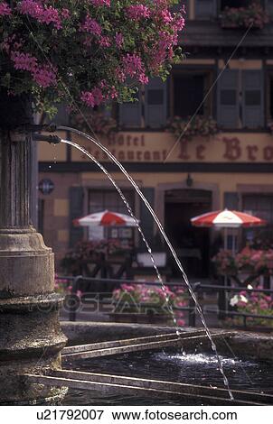 France, Alsace, Barr, Bas-Rhin, Europe, wine region, Close-up of a fountain decorated with pink geraniums in the picturesque village of Barr in the wine region of Alsace. View Large Photo Image Stock Photo - France, Alsace, Barr, Bas-Rhin, Europe, wine region, Close-up of a fountain decorated with pink geraniums in the picturesque village of Barr in the wine region of Alsace.. Fotosearch