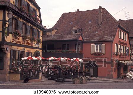 Stock Photograph -  France, Alsace, Barr, Bas-Rhin, Europe, wine region, Outdoor cafT in the picturesque village of Barr in the wine region of Alsace.. Fotosearch