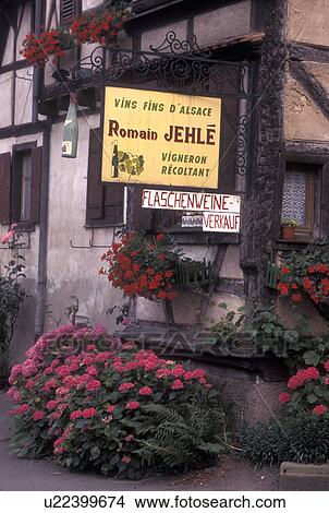 Picture -  France, Alsace, Dambach-la-Ville, Bas-Rhin, Europe, wine region, Entrance to a Wine House decorated with flowers in the village of Dambach-la-Ville in the wine region of Alsace.. Fotosearch