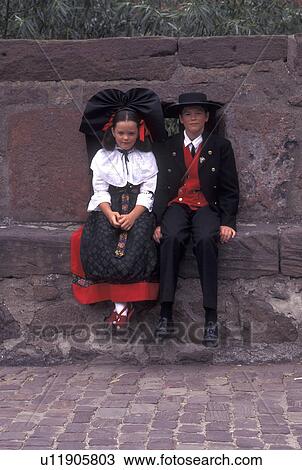 France, Alsace, Kaysersberg, Haut-Rhin, Europe, wine region, Girl and boy dressed authentic costumes sit on a stone wall in the village of Kaysersberg in the wine region of Alsace. View Large Photo Image Stock Image - France, Alsace, Kaysersberg, Haut-Rhin, Europe, wine region, Girl and boy dressed authentic costumes sit on a stone wall in the village of Kaysersberg in the wine region of Alsace.. Fotosearch