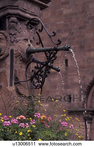France, Alsace, Kaysersberg, Haut-Rhin, Europe, wine region, A fountain decorated with pink and yellow flowers in the village of Kaysersberg in the wine region of Alsace. View Large Photo Image Stock Image - France, Alsace, Kaysersberg, Haut-Rhin, Europe, wine region, A fountain decorated with pink and yellow flowers in the village of Kaysersberg in the wine region of Alsace.. Fotosearch