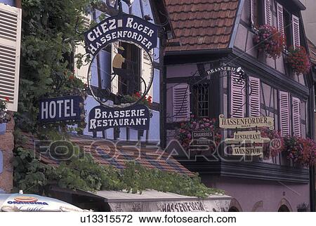 France, Alsace, Kaysersberg, Haut-Rhin, Europe, wine region, Store front signs and windows adorned with colorful flowers in window boxes on half-timbered buildings in the village of Kaysersberg in the wine region of Alsace. View Large Photo Image Stock Image - France, Alsace, Kaysersberg, Haut-Rhin, Europe, wine region, Store front signs and windows adorned with colorful flowers in window boxes on half-timbered buildings in the village of Kaysersberg in the wine region of Alsace.. Fotosearch