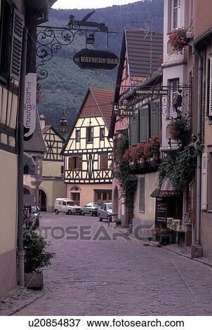 France, Alsace, Kaysersberg, Haut-Rhin, Europe, wine region, Narrow cobbled street surrounded by half-timbered buildings in the picturesque village of Kaysersberg in the wine region of Alsace. View Large Photo Image Stock Photo - France, Alsace, Kaysersberg, Haut-Rhin, Europe, wine region, Narrow cobbled street surrounded by half-timbered buildings in the picturesque village of Kaysersberg in the wine region of Alsace.. Fotosearch