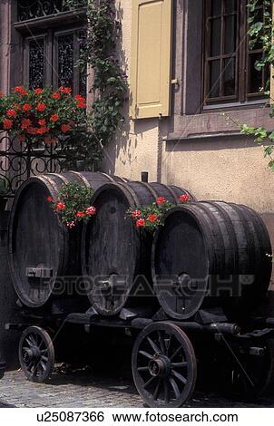 France, Alsace, Kaysersberg, Haut-Rhin, Europe, wine region, Old wooden wine barrels decorated with red geraniums on a wooden wagon in the village of Kaysersberg in the wine region of Alsace. View Large Photo Image Stock Photograph - France, Alsace, Kaysersberg, Haut-Rhin, Europe, wine region, Old wooden wine barrels decorated with red geraniums on a wooden wagon in the village of Kaysersberg in the wine region of Alsace.. Fotosearch