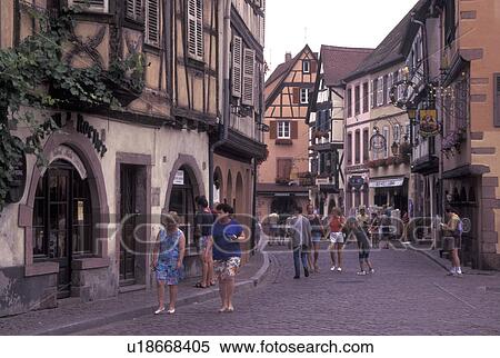 France, Alsace, Kaysersberg, Haut-Rhin, Europe, wine region, People shopping along the narrow cobblestone pedestrian streets surrounded by half-timbered buildings in the picturesque village of Kaysersberg in the wine region of Alsace. View Large Photo Image Stock Photography - France, Alsace, Kaysersberg, Haut-Rhin, Europe, wine region, People shopping along the narrow cobblestone pedestrian streets surrounded by half-timbered buildings in the picturesque village of Kaysersberg in the wine region of Alsace.. Fotosearch
