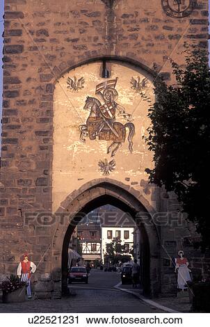 Stock Image -  France, Alsace, Mutzig, Bas-Rhin, Europe, wine region, 14th Century Gateway at the entrance to the picturesque village of Mutzig in the wine region of Alsace.. Fotosearch