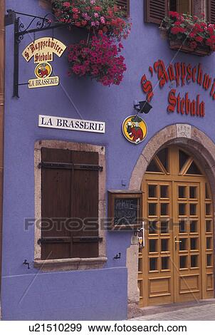 France, Alsace, Ribeauville, Haut-Rhin, Europe, wine region, Flowers decorated the colorful purple entrance to a Brasserie (restaurant) in the village of Ribeauville in the wine region of Alsace. View Large Photo Image Stock Photo - France, Alsace, Ribeauville, Haut-Rhin, Europe, wine region, Flowers decorated the colorful purple entrance to a Brasserie (restaurant) in the village of Ribeauville in the wine region of Alsace.. Fotosearch