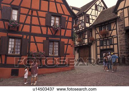 France, Alsace, Riquerwihr, Haut-Rhin, Europe, wine region, Picturesque village of Riquerwihr with its half-timbered buildings adorned with flowers and cobbled streets in the wine region of Alsace. View Large Photo Image Stock Photo - France, Alsace, Riquerwihr, Haut-Rhin, Europe, wine region, Picturesque village of Riquerwihr with its half-timbered buildings adorned with flowers and cobbled streets in the wine region of Alsace.. Fotosearch