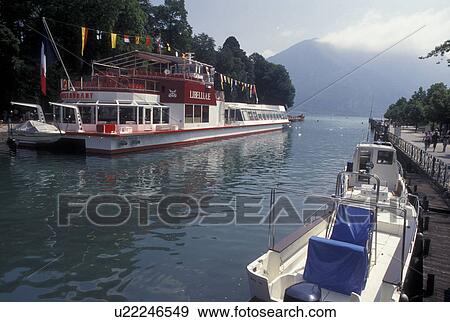 France, Annecy, Haute-Savoie, Rhone-Alpes, Europe, Excursion boat docked on Thiou canal on scenic Lake Annecy (Lac d' Annecy) in Annecy. View Large Photo Image Stock Photo - France, Annecy, Haute-Savoie, Rhone-Alpes, Europe, Excursion boat docked on Thiou canal on scenic Lake Annecy (Lac d' Annecy) in Annecy. . Fotosearch