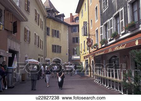 Stock Photo -  France, Annecy, Haute-Savoie, Rhone-Alpes, Europe, Shops along a narrow pedestrian street in the old town of Annecy. . Fotosearch