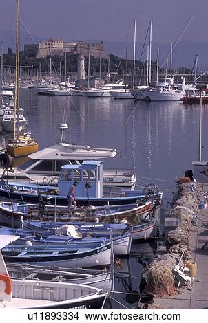 France, Antibes, Cote d' Azur, Provence, Alpes-Maritimes, Europe, Fishing boats docked in Port Vauban Harbor on the Mediterranean Sea in the city of Antibes. Fishing nets piled on the dock. View Large Photo Image Picture - France, Antibes, Cote d' Azur, Provence, Alpes-Maritimes, Europe, Fishing boats docked in Port Vauban Harbor on the Mediterranean Sea in the city of Antibes. Fishing nets piled on the dock.. Fotosearch