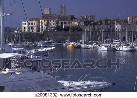 Stock Image -  France, Antibes, Cote d' Azur, Provence, Alpes-Maritimes, Europe, Boats docked in Port Vauban Harbor on the Mediterranean Sea in the city of Antibes.. Fotosearch