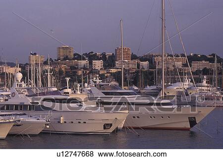 France, Antibes, Cote d' Azur, Provence, Alpes-Maritimes, Europe, Yachts docked in Port Vauban Harbor on the Mediterranean Sea in the city of Antibes. View Large Photo Image Stock Photo - France, Antibes, Cote d' Azur, Provence, Alpes-Maritimes, Europe, Yachts docked in Port Vauban Harbor on the Mediterranean Sea in the city of Antibes. . Fotosearch