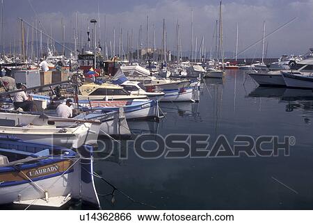 France, Antibes, Cote d' Azur, Provence, Alpes-Maritimes, Europe, Fishing boats and pleasure boats docked in Port Vauban Harbor on the Mediterranean Sea in the city of Antibes. View Large Photo Image Stock Photograph - France, Antibes, Cote d' Azur, Provence, Alpes-Maritimes, Europe, Fishing boats and pleasure boats docked in Port Vauban Harbor on the Mediterranean Sea in the city of Antibes.. Fotosearch