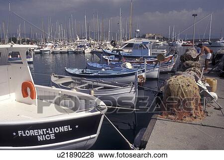 France, Antibes, fishing boats, Cote d' Azur, Provence, Alpes-Maritimes, Europe, Fishing boats docked in Port Vauban Harbor on the Mediterranean Sea in the city of Antibes. Fishing nets piled on the dock. View Large Photo Image Stock Photo - France, Antibes, fishing boats, Cote d' Azur, Provence, Alpes-Maritimes, Europe, Fishing boats docked in Port Vauban Harbor on the Mediterranean Sea in the city of Antibes. Fishing nets piled on the dock.. Fotosearch