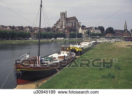 France, Auxerre, Burgundy, Yonne, wine region, Bourgogne, Europe, Scenic view of the Ste-Etienne cathedral and the barges along the Yonne River in the city of Auxerre in the wine region of Burgundy. View Large Photo Image Stock Photo - France, Auxerre, Burgundy, Yonne, wine region, Bourgogne, Europe, Scenic view of the Ste-Etienne cathedral and the barges along the Yonne River in the city of Auxerre in the wine region of Burgundy.. Fotosearch