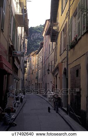 Stock Image -  France, Breil-sur-Roya, Alpes, Alpes-Maritimes, Europe, Narrow street in the village of Breil-s-Roya.. Fotosearch