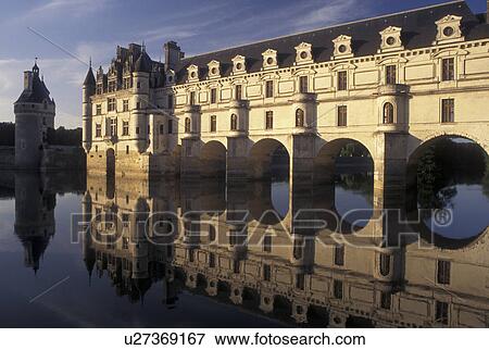 Stock Photo -  France, castle, Loire Valley, Chenonceau, Loire Castle Region, Indre-et-Loire, Europe, Reflection of the 16th century Chateau de Chenonceau spanning the Cher River.. Fotosearch