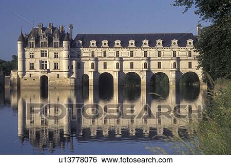 Stock Photograph -  France, Chenonceau, castle, Loire Valley, Loire Castle Region, Indre-et-Loire, Europe, Reflection of the 16th century Chateau de Chenonceau in the Cher River.. Fotosearch
