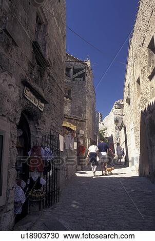France, Les Baux de Provence, Bouche-du-Rhone, Provence, Europe, Shops along a narrow cobbled street in the medieval village of Les Baux de Provence. View Large Photo Image Stock Image - France, Les Baux de Provence, Bouche-du-Rhone, Provence, Europe, Shops along a narrow cobbled street in the medieval village of Les Baux de Provence.. Fotosearch