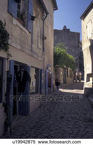 France, Les Baux de Provence, Bouche-du-Rhone, Provence, Europe, Shops along a narrow cobbled street in the medieval village of Les Baux de Provence. View Large Photo Image Stock Photography - France, Les Baux de Provence, Bouche-du-Rhone, Provence, Europe, Shops along a narrow cobbled street in the medieval village of Les Baux de Provence.. Fotosearch