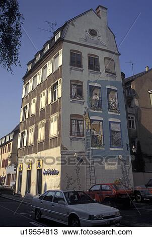 Stock Image -  France, Mulhouse, Alsace, Haut-Rhin, Europe, Fresco painting on side of a building in the village of Mulhouse. Fotosearch