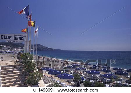 France, Nice, Cote d' Azur, Provence, Alpes-Maritimes, Europe, Outdoor restaurant along the Promenade des Anglais on the beach along the Mediterranean Sea in the city of Nice. View Large Photo Image Stock Image - France, Nice, Cote d' Azur, Provence, Alpes-Maritimes, Europe, Outdoor restaurant along the Promenade des Anglais on the beach along the Mediterranean Sea in the city of Nice. . Fotosearch