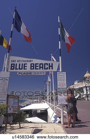 France, Nice, Cote d' Azur, Provence, Alpes-Maritimes, Europe, Outdoor restaurant along the Promenade des Anglais on the beach along the Mediterranean Sea in the city of Nice. View Large Photo Image Stock Photograph - France, Nice, Cote d' Azur, Provence, Alpes-Maritimes, Europe, Outdoor restaurant along the Promenade des Anglais on the beach along the Mediterranean Sea in the city of Nice. . Fotosearch