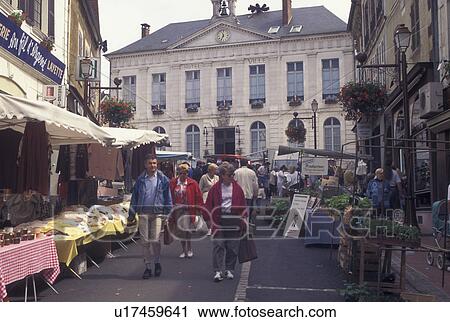 Stock Image -  France, outdoor market, Burgundy, Toucy, Yonne, Bourgogne, Europe, Market Day in downtown Toucy in the region of Burgundy.. Fotosearch
