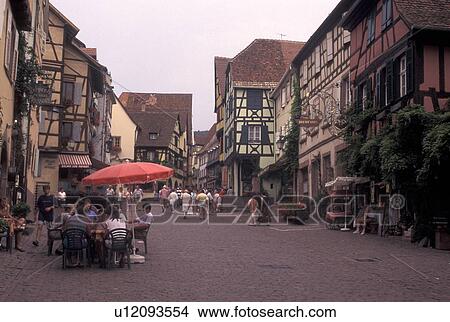 France, Riquewihr, Alsace, Haut-Rhin, Europe, outdoor cafT, wine region, Half-timbered buildings in the picturesque village of Riquewihr in the wine region of Alsace. View Large Photo Image Picture - France, Riquewihr, Alsace, Haut-Rhin, Europe, outdoor cafT, wine region, Half-timbered buildings in the picturesque village of Riquewihr in the wine region of Alsace.. Fotosearch