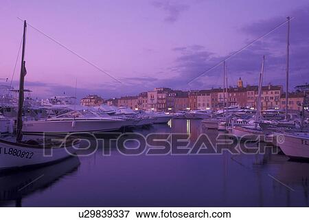 France, St. Tropez, harbor, Cote d' Azur, Provence, Var, Europe, Yachts docked in the harbor of Saint Tropez at sunset on the Mediterranean Sea. View Large Photo Image Stock Photo - France, St. Tropez, harbor, Cote d' Azur, Provence, Var, Europe, Yachts docked in the harbor of Saint Tropez at sunset on the Mediterranean Sea.. Fotosearch